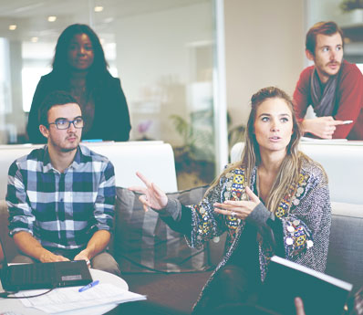 A group of adults having a meeting at work